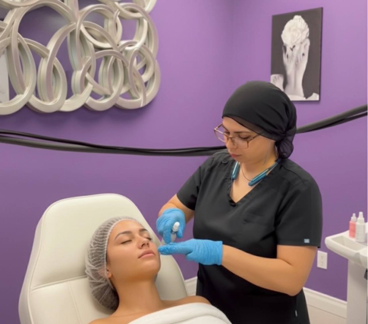 Skin rejuvenation facial treatment with medical-grade device applied by specialist at American Laser Plus